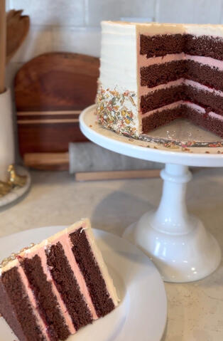 Valentines Cake Slice Sugar, cake flour (wheat), butter (milk), powdered sugar, eggs, cocoa powder, chocolate, buttermilk, pasteurized egg whites, water, chocolate custard, baking soda, salt, vanilla, raspberry compote.