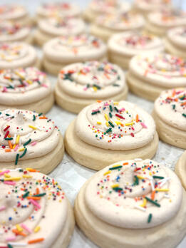 Classic Dozen One dozen of our signature bakery-style sugar cookies, frosted with a thick swirl of buttercream and finished with sprinkles. Try not to fall in love ;) $36.00